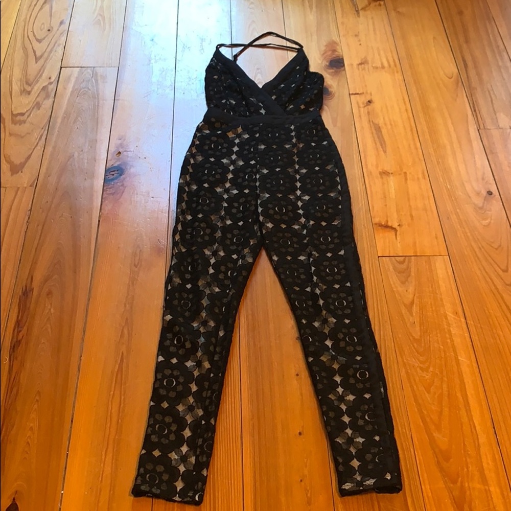 Black, lace jumpsuit, with crossed straps